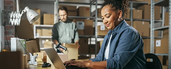 Small business owners packing and shipping products